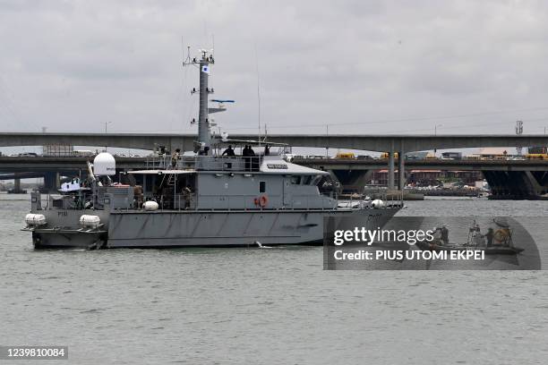 Italian marines on a boat invades a Nigerian vessel to apprehend pirates, sea robbers during a joint demonstration exercise between the Nigeria navy...