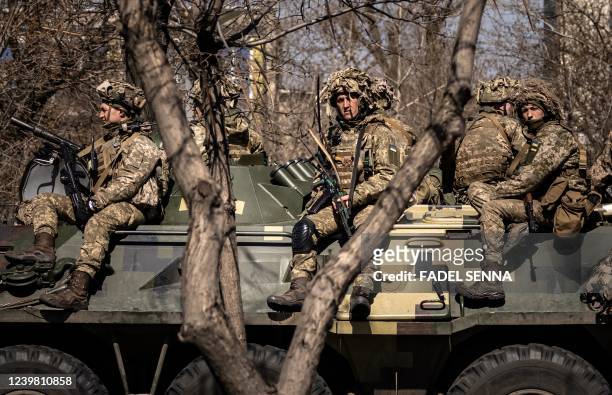 Ukrainian soldiers sit on a armoured military vehicule in the city of Severodonetsk, Donbas region, on April 7 amid Russia's military invasion...