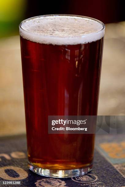 Pint of Jongleurs bitter sits on the bar at The Knights Templar public house, operated by JD Wetherspoon Plc, in London, U.K., on Wednesday, Sept. 7,...