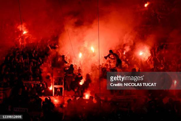 Marseille fans light flares and cheer during the UEFA Europa Conference League quarter-final second leg football match between Olympique de Marseille...