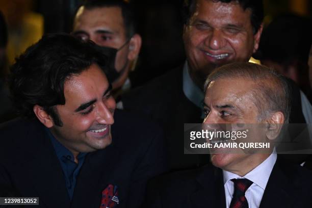 Pakistan's opposition leader Shahbaz Sharif and Bilawal Bhutto Zardari smile during a press conference with other parties leaders in Islamabad on...