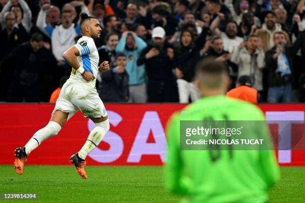 Marseille's French midfielder Dimitri Payet celebrates after scoring a goal during the Europa Conference League quarter final match between Olympique...