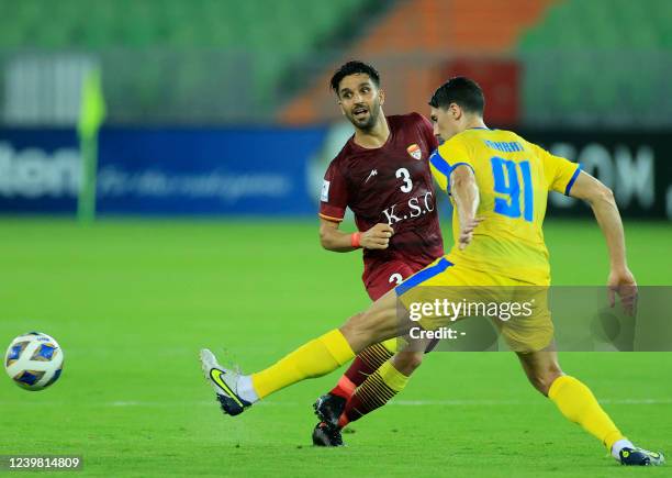 Al-Gharafa's defender Mehdi Jean-Tahrat marks Foolad's forward Sasan Ansari during the AFC Champions League group C match between Iran's Foolad and...