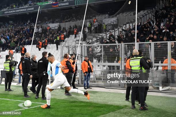 Marseille's French midfielder Dimitri Payet shoots a corner kick protected by a net during the Europa Conference League quarter final match between...