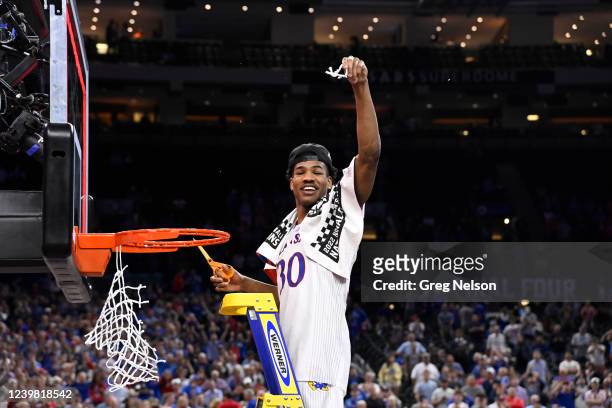 Finals: Kansas Ochai Agbaji victorious, cutting down net after defeating UNC at Caesars Superdome. New Orleans, LA 4/4/2022 CREDIT: Greg Nelson