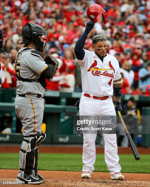 Yadier Molina of the St. Louis Cardinals acknowledges a standing ovation by fans as he comes up to bat during the first inning against the Pittsburgh...