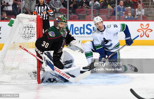 Alex Chiasson of the Vancouver Canucks looks for a pass as goaltender Harri Sateri of the Arizona Coyotes gets ready to make a save during the first...