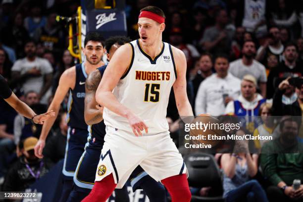 Nikola Jokic of the Denver Nuggets posts up defenders against the Memphis Grizzlies at Ball Arena on April 7, 2022 in Denver, Colorado. NOTE TO USER:...