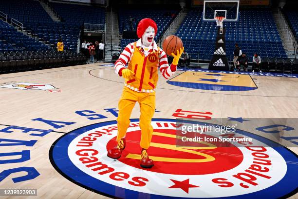 Ronald McDonald does ball tricks at center court before the 2022 McDonalds High School All American Girls Game at Wintrust Arena.