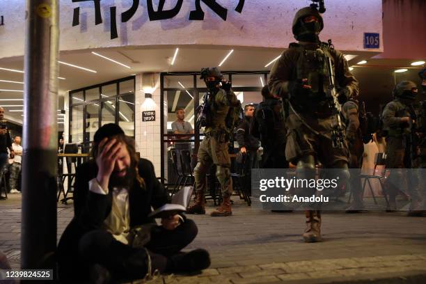 Police officers take security measures at Dizengoff Street after an armed attack in Tel Aviv, Israel on April 07, 2022. At least two people were...