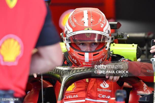 Ferrari's Monegasque driver Charles Leclerc gets out of the car during the second practice session ahead of the 2022 Formula One Australian Grand...