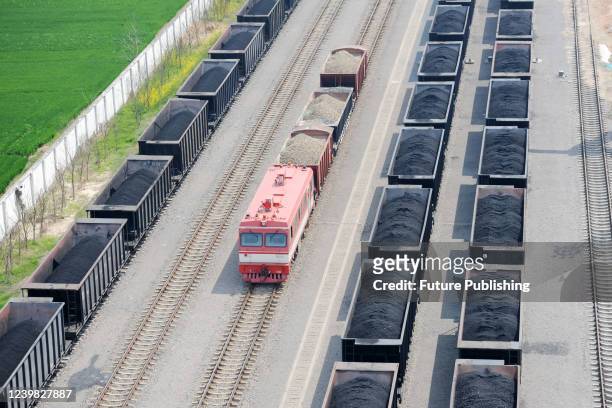An aerial view of the loading yard of a coal mine in Huaibei in central China's Anhui province Thursday, April 07, 2022.