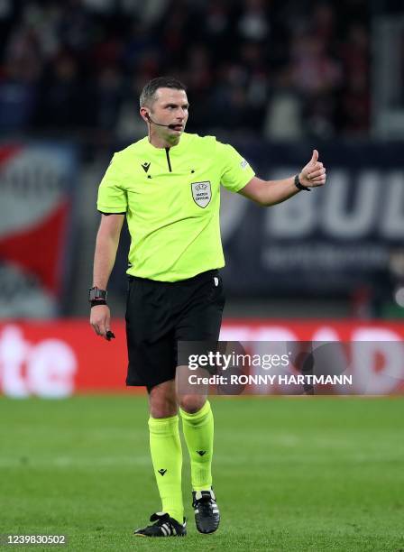 English referee Michael Oliver reacts during the UEFA Europa League quarter-final, first-leg football match RB Leipzig v Atalanta in Leipzig on April...