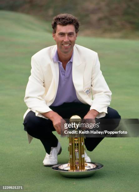 Mike Harwood of Australia celebrates with the trophy after winning the GA European Open at Walton Heath Golf Club on September 1, 1991 in Tadworth,...