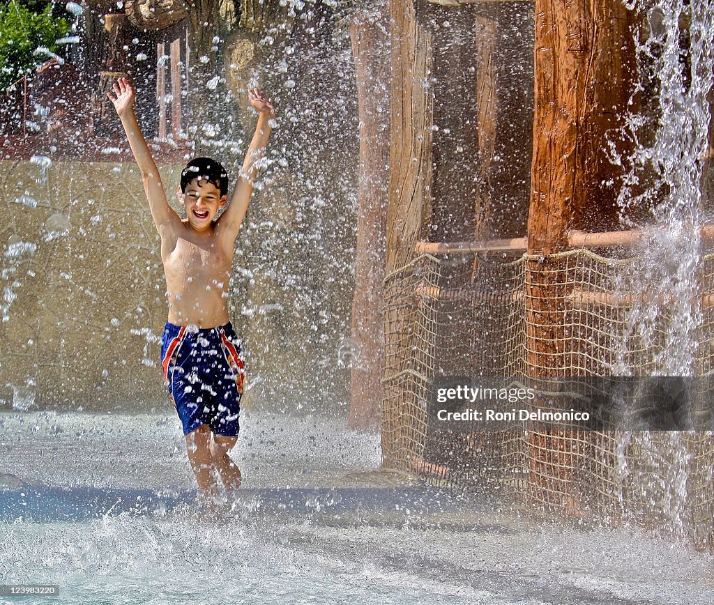 Boy enjoys his time at water park on vacation