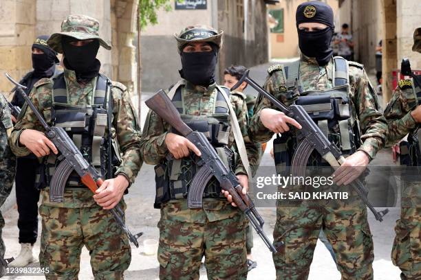 Members of the Islamic Jihad militant group take part in a rally alongside Hamas supporters after Friday prayers in Khan Yunis The Southern Gaza...