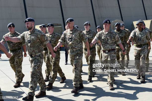 Britain's soldiers march after the visit of Britain's Defence Secretary at the Mihail Kogalniceanu Air Base near Constanta, Romania, on April 8, 2022.