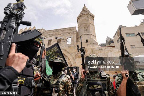 Members of the Islamic Jihad militant group take part in a rally alongside Hamas supporters after Friday prayers in Khan Yunis The Southern Gaza...
