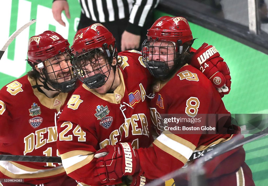 Denvers Carter Savoie is congratulated by Cole Guttman and Bobby