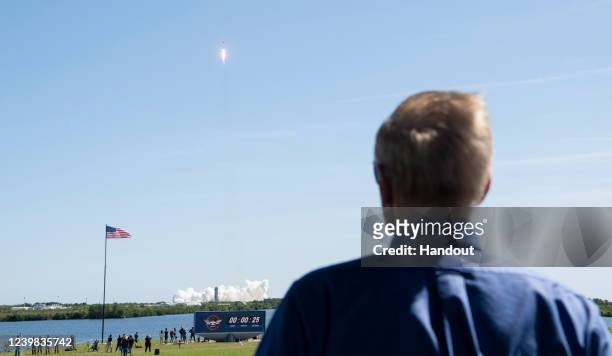 In this handout photo provided by the National Aeronautics and Space Administration, NASA Administrator Bill Nelson watches the launch of a SpaceX...