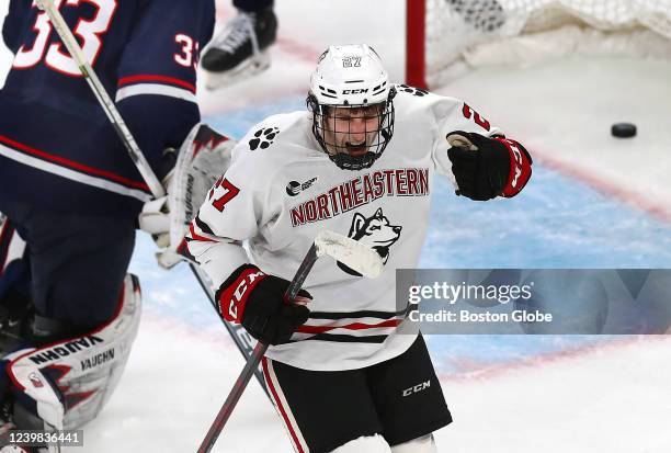 Northeastern forward Jack Hughes celebrates a 1st period goal by Northeastern forward Aidan McDonough getting the puck past UConn goaltender Darion...