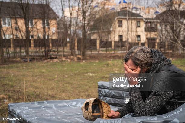 Mass grave is exhumed by local authorities as they attempt to identify the bodies of civilians who had died during the Russian occupation in Bucha,...