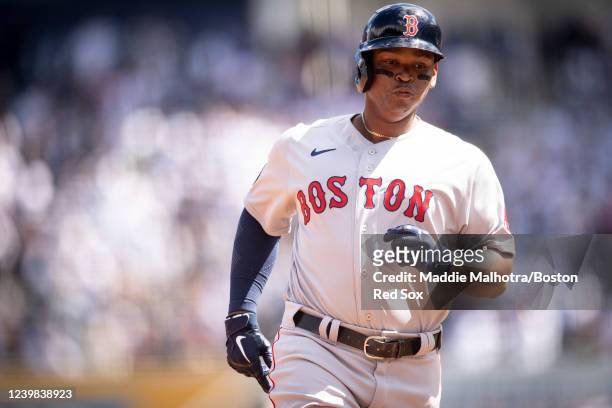 Rafael Devers of the Boston Red Sox runs after hitting a two-run home run during the first inning of the 2022 Major League Baseball Opening Day game...