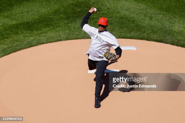 Quarterback Russell Wilson of the Denver Broncos throws out the first pitch before a game between the Colorado Rockies and the Los Angeles Dodgers on...