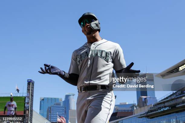 Julio Rodriguez of the Seattle Mariners reacts after getting thrown out at first base against the Minnesota Twins in his Major League debut in the...