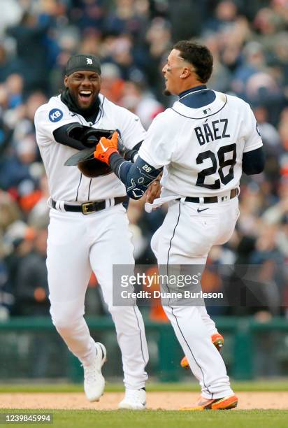 Javier Baez of the Detroit Tigers celebrates with Akil Baddoo after hitting a walk-off single to drive in Austin Meadows during the ninth inning of...