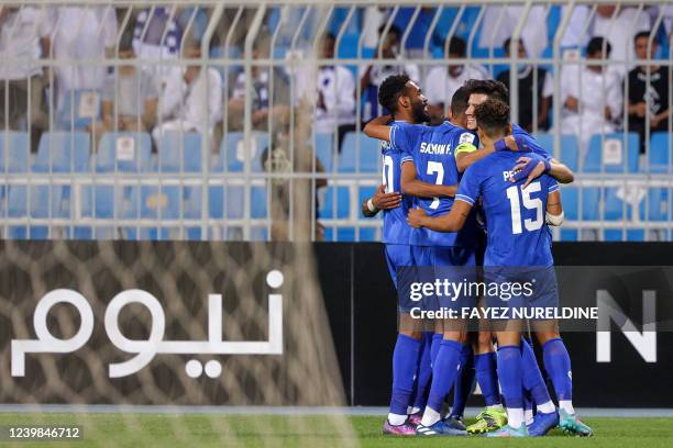 Players of al-Hilal celebrate after scoring a second goal during the AFC Champions League Group A match between Saudi's al-Hilal and UAE's Sharjah at...