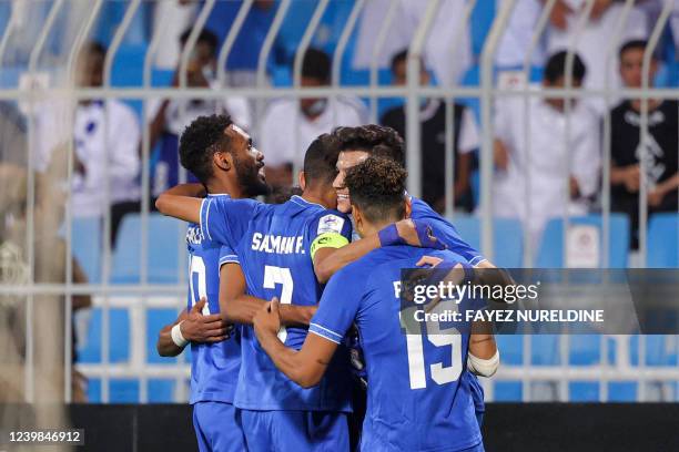 Players of al-Hilal celebrate after scoring a second goal during the AFC Champions League Group A match between Saudi's al-Hilal and UAE's Sharjah at...