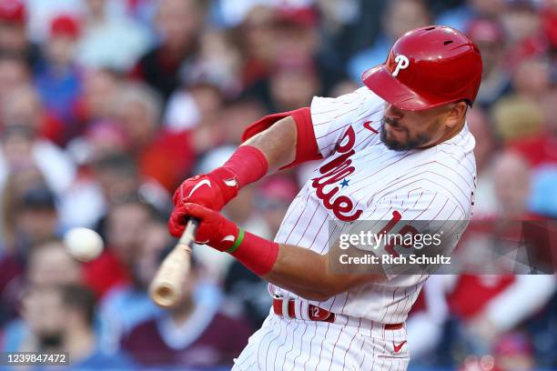 Kyle Schwarber of the Philadelphia Phillies hits an RBI single against the Oakland Athletics during the eighth inning of the Opening Day game at...