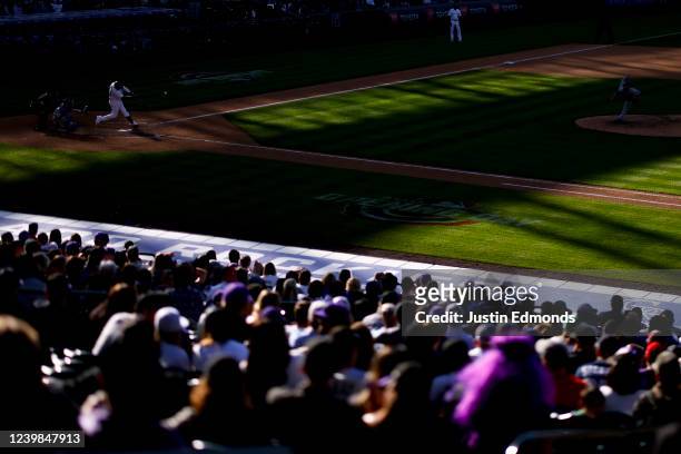 Elias Diaz of the Colorado Rockies hits a double off of Craig Kimbrel of the Los Angeles Dodgers in the ninth inning on Opening Day at Coors Field on...