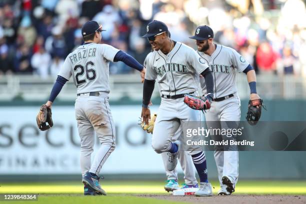 Julio Rodriguez and Adam Frazier of the Seattle Mariners celebrate a 2-1 victory against the Minnesota Twins in Rodriguez's Major League debut on...