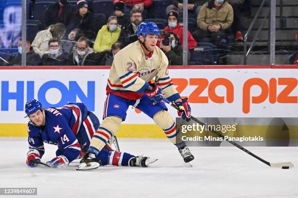 Shawn St. Amant of the Laval Rocket skates the puck past Mark Jankowski of the Rochester Americans during the second period at Place Bell on April 8,...
