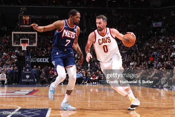 Kevin Durant of the Brooklyn Nets plays defense on Kevin Love of the Cleveland Cavaliers during the game on April 8, 2022 at Barclays Center in...