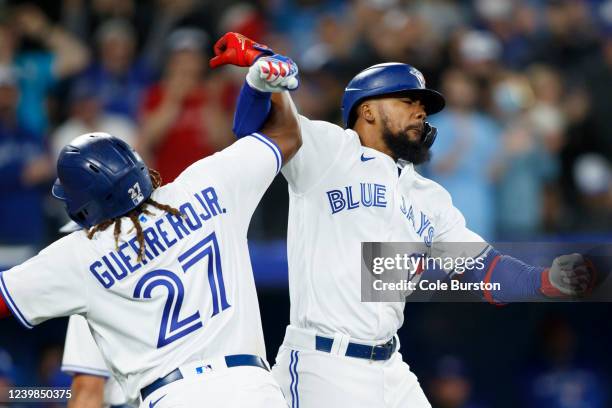 Teoscar Hernandez of the Toronto Blue Jays celebrates a three run home run with Vladimir Guerrero Jr. #27 in the fifth inning of their MLB game...