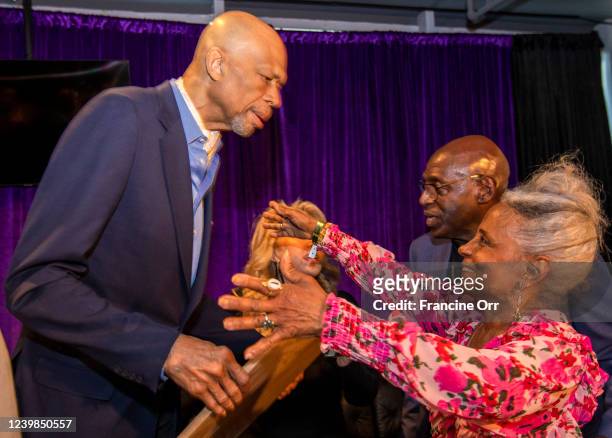 Los Angeles, CA Eleanor McCoy, right, reaches up to hug Kareem Abdul-Jabbar during his birthday celebration in the Lakers Lounge at Crypto.com on...