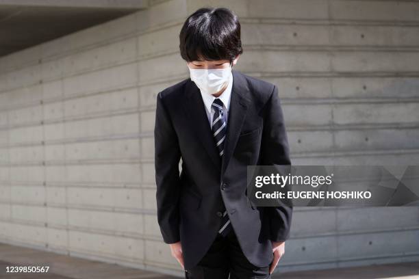 Japan's Prince Hisahito greets after posing for media before his entrance ceremony of the senior high school affiliated with University of Tsukuba in...