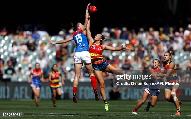Lauren Pearce of the Demons and Caitlin Gould of the Crows compete for the ball at the opening bounce during the 2022 AFLW Grand Final match between...