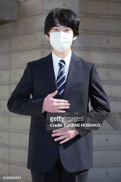 Japan's Prince Hisahito gestures as he poses for media before his entrance ceremony of the senior high school affiliated with University of Tsukuba...