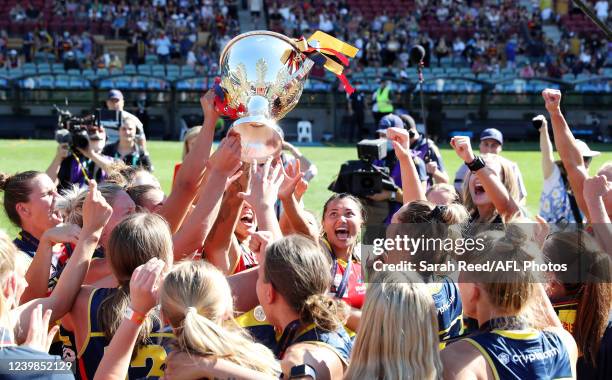 Crows players hold up the premiership cup during the 2022 AFLW Grand Final match between the Adelaide Crows and the Melbourne Demons at Adelaide Oval...