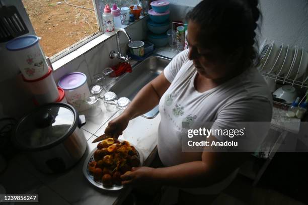 Noralba LÃ³pez, beneficiary of the Land Restitution Unit, cooks chontaduro for her family in VillagarzÃ³n, Putumayo, Colombia, on April 03, 2022....