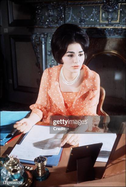 Undated picture of Iranian impress Farah Diba, wife of Chah Mohammed Reza Palhavi, in his office in Tehran.