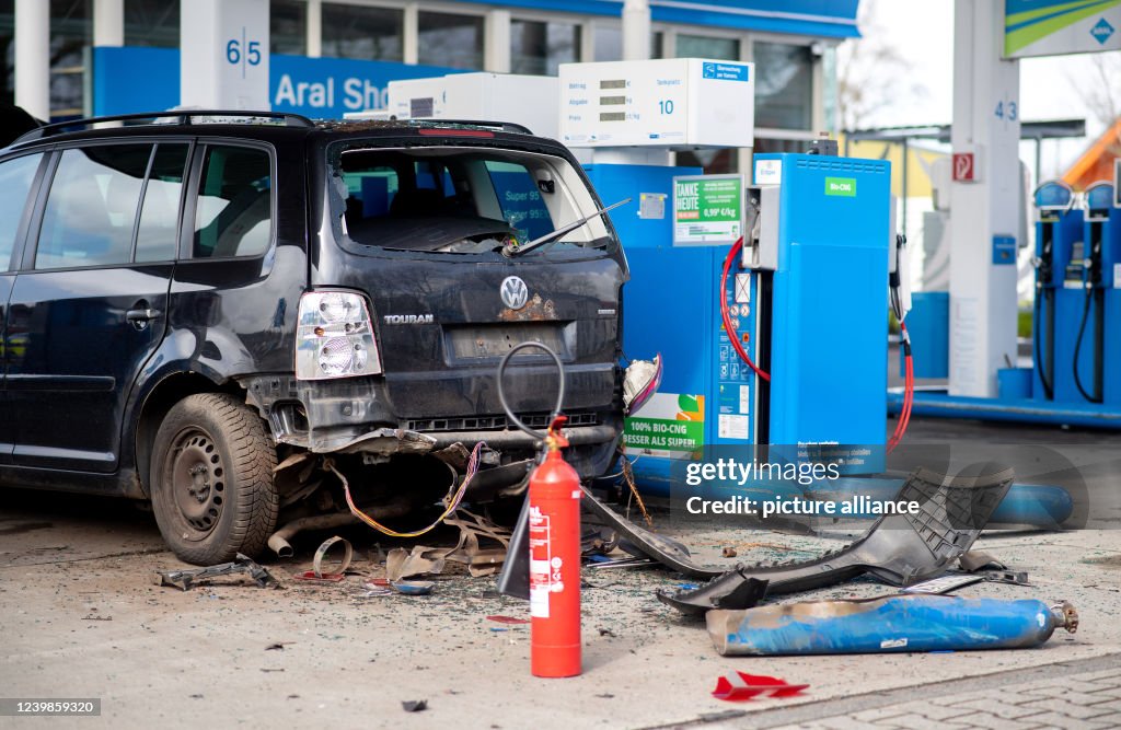 Gas Container Exploded A natural gas vehicle whose tank exploded during refueling stands ...