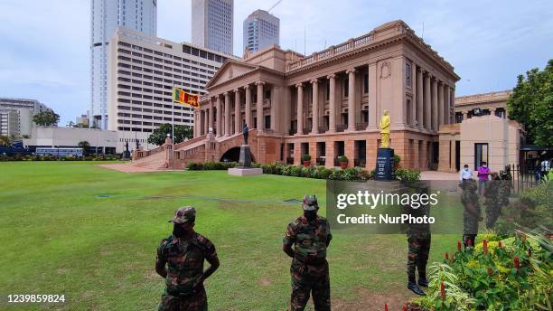 Sri Lankan police and army soldiers provide security outside the official president's office during a protest at Colombo, Sri Lanka on 9 Saturday...