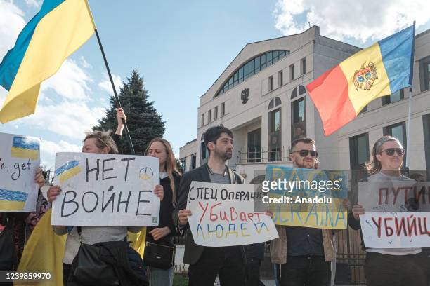 Protesters, holding banners and flags, gather to protest Russian attacks on Ukraine in front of the Russian Embassy in Chisinau, Moldova on April 9,...