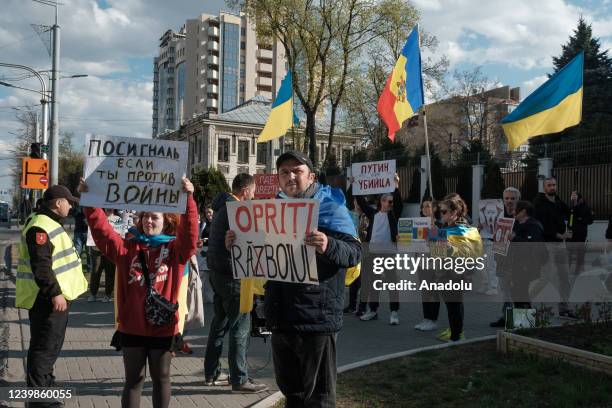 Protesters, holding banners and flags, gather to protest Russian attacks on Ukraine in front of the Russian Embassy in Chisinau, Moldova on April 9,...