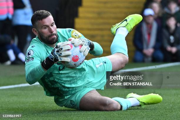 Watford's English goalkeeper Ben Foster makes a save during the English Premier League football match between Watford and Leeds United at Vicarage...